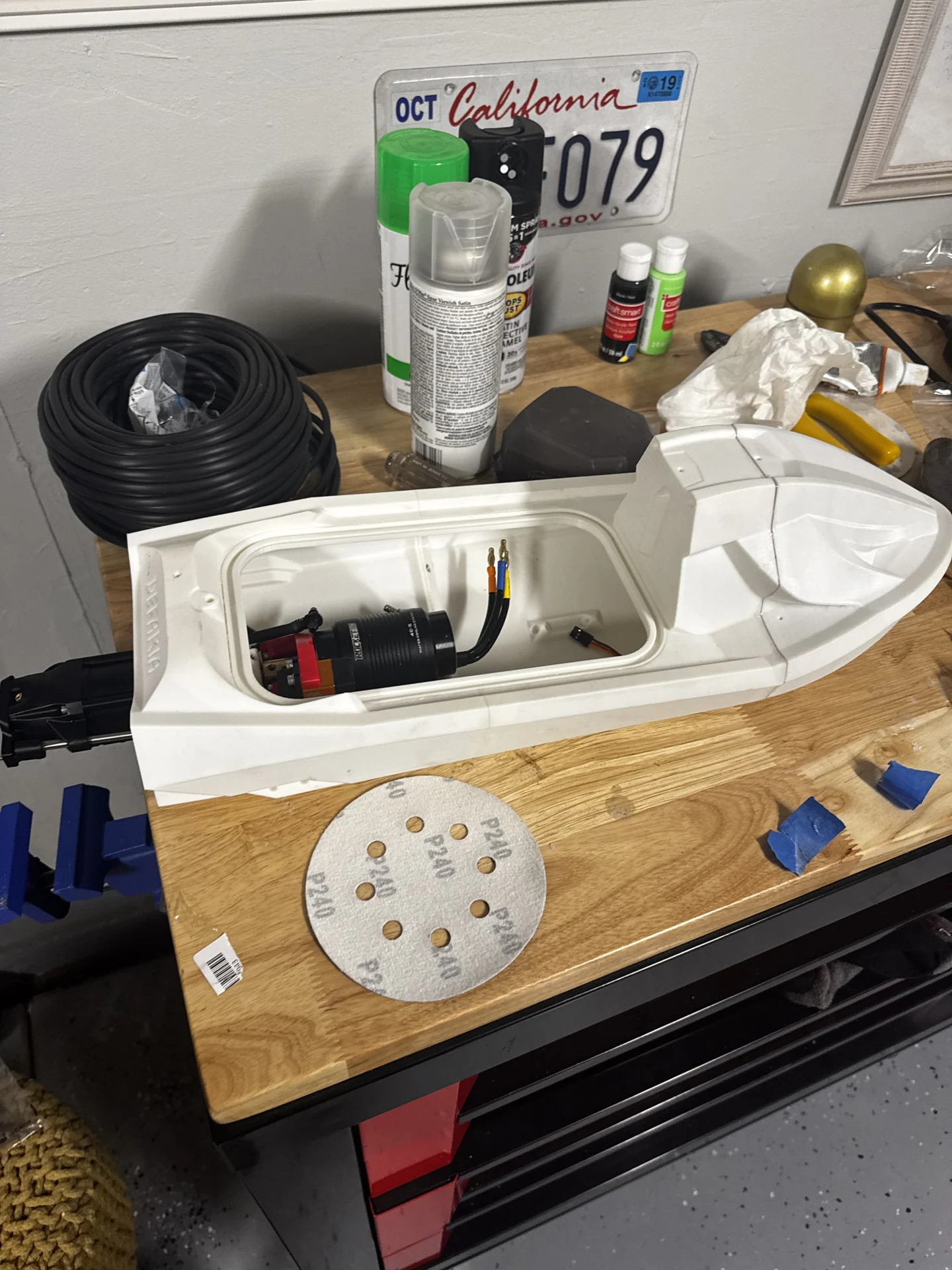 Valkyrie printed hull open during motor installation on a workbench.
